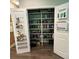 Walk-in pantry with open shelving for storage, plus door shelving at 201 Jonquil Spring Rd, Woodstock, GA 30188