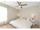 Serene bedroom with natural light, a ceiling fan, and neutral decor creating a peaceful retreat at 3200 Binghampton Ln, Lawrenceville, GA 30044