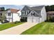 Inviting home with a well-kept lawn and a convenient two-car garage, perfect for modern living at 3200 Binghampton Ln, Lawrenceville, GA 30044