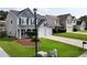 Attractive two-story home features a well-maintained lawn and a convenient two-car garage at 3200 Binghampton Ln, Lawrenceville, GA 30044