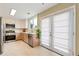 Well-appointed kitchen featuring stainless steel appliances, bright countertops, and French doors providing access to outdoor area at 3200 Binghampton Ln, Lawrenceville, GA 30044