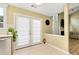 Bright kitchen featuring modern stainless steel appliances, direct access to an outdoor patio area, and seamless entry to living room at 3200 Binghampton Ln, Lawrenceville, GA 30044