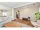 Spacious living room with hardwood floors and neutral colors open to the dining room at 3200 Binghampton Ln, Lawrenceville, GA 30044