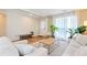 Spacious living room filled with natural light, modern furniture, and wood flooring, perfect for relaxing and entertaining at 3200 Binghampton Ln, Lawrenceville, GA 30044