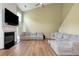 Bright living room featuring a fireplace, hardwood floors, and contemporary, neutral-toned decor at 3200 Binghampton Ln, Lawrenceville, GA 30044
