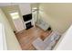 High angle view of a spacious living room with modern furniture, hardwood floors, and large windows at 3200 Binghampton Ln, Lawrenceville, GA 30044