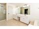 Large primary bathroom featuring double sinks, white cabinets, a glass enclosed shower, and a soaking tub at 3200 Binghampton Ln, Lawrenceville, GA 30044