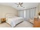 Spacious main bedroom with carpet, ceiling fan, sitting area and neutral tones at 3200 Binghampton Ln, Lawrenceville, GA 30044