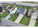 View of homes from the street, highlighting manicured lawns and mature landscaping at 3200 Binghampton Ln, Lawrenceville, GA 30044