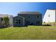 The backyard features a new patio, ample green space, and tidy landscaping at 5440 Wheeler Ridge Rd, Auburn, GA 30011