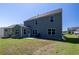The backyard features a new patio, ample green space, and tidy landscaping at 5440 Wheeler Ridge Rd, Auburn, GA 30011