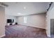 Large bonus room with carpeted floors, recessed lighting, barn door, and ample space for entertainment at 5440 Wheeler Ridge Rd, Auburn, GA 30011