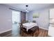 Charming dining room with modern light fixture, table with bench and chairs, and barn door at 5440 Wheeler Ridge Rd, Auburn, GA 30011