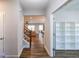 Hallway leading to an open-concept living space, with hardwood floors and neutral paint at 5440 Wheeler Ridge Rd, Auburn, GA 30011