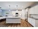 Modern kitchen with center island, stainless appliances, and ample cabinet space for all cooking needs at 5440 Wheeler Ridge Rd, Auburn, GA 30011