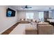 Comfortable living room with plush sectional sofa, large TV, and modern ceiling fan at 5440 Wheeler Ridge Rd, Auburn, GA 30011