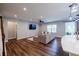 Spacious living room with a view of the kitchen, ideal for entertaining guests or relaxing with Gathering at 5440 Wheeler Ridge Rd, Auburn, GA 30011