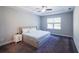 Bright main bedroom with a ceiling fan, gray walls, carpet, and natural light from the windows at 5440 Wheeler Ridge Rd, Auburn, GA 30011