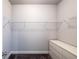 Spacious walk-in closet featuring wire shelving, a dresser, and plush carpeting for optimal organization at 5440 Wheeler Ridge Rd, Auburn, GA 30011