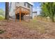 View of backyard, wood deck, and wooden fence surrounding the property at 1111 Pin Oak Dr, Tucker, GA 30084