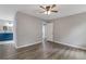 Bedroom with ensuite bath featuring blue vanity, hardwood floors and ample space at 1111 Pin Oak Dr, Tucker, GA 30084