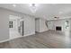Open-concept layout showcasing the living room with wood floors, connecting to the kitchen at 1111 Pin Oak Dr, Tucker, GA 30084