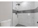 Close up of modern bathroom shower with black hardware and beautifully tiled walls at 1111 Pin Oak Dr, Tucker, GA 30084