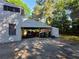 Attached carport offering covered parking and extra storage space for outdoor equipment at 2344 Country Club Se Dr, Conyers, GA 30013