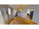 Dining room with light fixture and view into kitchen and entryway at 2344 Country Club Se Dr, Conyers, GA 30013