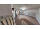 Large living room featuring wainscoting along the walls and neutral carpeting throughout at 2344 Country Club Se Dr, Conyers, GA 30013