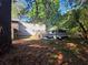 Backyard featuring above ground pool, fenced off area and shed at 2344 Country Club Se Dr, Conyers, GA 30013