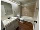 Bright bathroom features a modern vanity, recessed lighting, and a shower-tub combination at 2449 Terrace Trl, Decatur, GA 30035