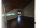 Bedroom with dark floors, vaulted ceiling and natural light from sliding glass door at 2449 Terrace Trl, Decatur, GA 30035
