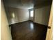 This bedroom features dark floors, a large closet and a window at 2449 Terrace Trl, Decatur, GA 30035