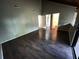 Spacious bedroom boasts with dark wood flooring, high ceiling, and multiple doors for added convenience at 2449 Terrace Trl, Decatur, GA 30035