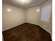 Empty bedroom with wood floors, a window, and neutral paint at 2449 Terrace Trl, Decatur, GA 30035