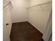 Walk-in closet with dark wood flooring and shelving to keep your items organized at 2449 Terrace Trl, Decatur, GA 30035