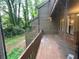 Exterior view of a wood deck overlooking a lush, green landscape with trees at 2449 Terrace Trl, Decatur, GA 30035