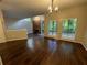 Dining area with hardwood floors, chandelier, and view of the fireplace in the living room at 2449 Terrace Trl, Decatur, GA 30035