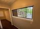 Hallway with view to the exterior of the home, neutral paint and wood floors at 2449 Terrace Trl, Decatur, GA 30035