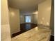A view from the kitchen into the living room, showcasing the home's dark wood floors at 2449 Terrace Trl, Decatur, GA 30035