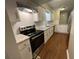 Updated kitchen with white cabinets, stainless steel appliances, and marbled countertops at 2449 Terrace Trl, Decatur, GA 30035