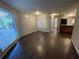 Spacious open-concept living room featuring dark hardwood floors and plenty of natural light at 2449 Terrace Trl, Decatur, GA 30035