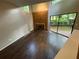 Living room featuring hardwood floors, a fireplace, and sliding doors that lead to a deck at 2449 Terrace Trl, Decatur, GA 30035