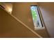 Staircase with window view of a tree and the exterior of the home at 2449 Terrace Trl, Decatur, GA 30035