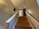 Upward view of a stairway with neutral-colored walls and a white handrail at 2449 Terrace Trl, Decatur, GA 30035