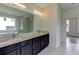 Bathroom showcases a double vanity, granite countertops, modern fixtures, and a soaking tub at 3065 Reserve Ct Sw, Conyers, GA 30094