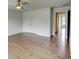 Bedroom with hardwood floors and white doors that lead to other rooms at 3065 Reserve Ct Sw, Conyers, GA 30094