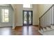 Elegant entryway featuring decorative double doors and hardwood floors at 3065 Reserve Ct Sw, Conyers, GA 30094