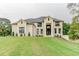 Elegant two-story home featuring a manicured lawn and a grand entrance at 3065 Reserve Ct Sw, Conyers, GA 30094